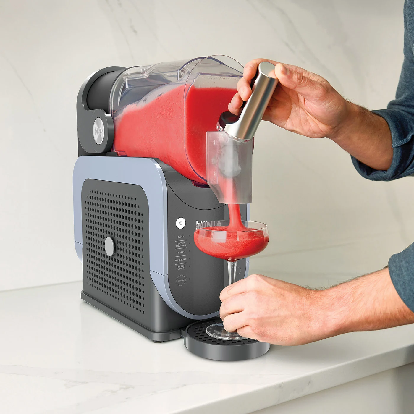 Ninja-FS301UK_InUse_Kitchen_OnCounter_Dispensing_Man_Strawberry_EXT